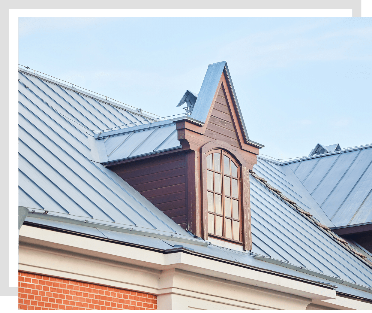 Metal roof with dormer and window.
